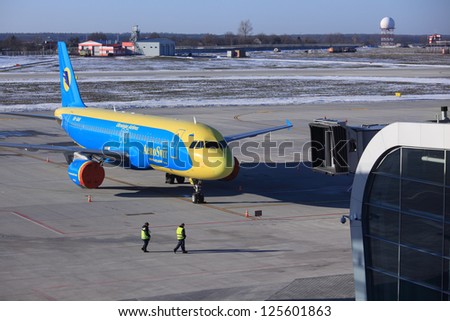 LVOV, UKRAINE - DECEMBER 31: Liner of Ukrainian Aerosvit airlines company on December 31, 2012 in Lvov Airport. Many Aerosvit liners was delayed due to bankruptcy of company filed at December 2012.