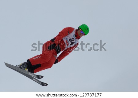 BUKOVEL, UKRAINE - FEBRUARY 23: Chao Wu, China performs aerial skiing during Freestyle Ski World Cup in Bukovel, Ukraine on February 23, 2013.