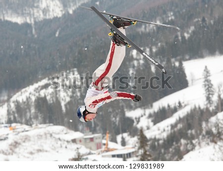 BBUKOVEL, UKRAINE - FEBRUARY 23: Travis Gerrits, Canada performs aerial skiing during Freestyle Ski World Cup in Bukovel, Ukraine on February 23, 2013.