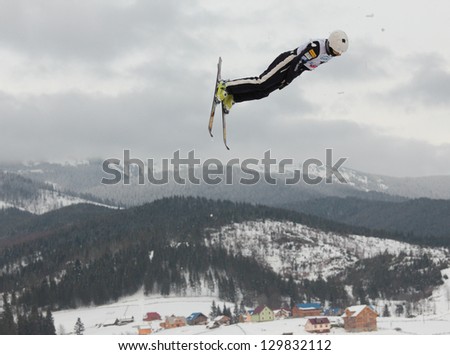 BUKOVEL, UKRAINE - FEBRUARY 23: Michael Rossi, USA performs aerial skiing during Freestyle Ski World Cup in Bukovel, Ukraine on February 23, 2013.