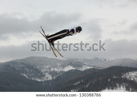 BUKOVEL, UKRAINE - FEBRUARY 23: Dylan Ferguson, USA performs aerial skiing during Freestyle Ski World Cup in Bukovel, Ukraine on February 23, 2013