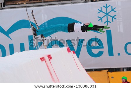 BUKOVEL, UKRAINE - FEBRUARY 23: Lloyd Wallace, Great Britain performs aerial skiing during Freestyle Ski World Cup in Bukovel, Ukraine on February 23, 2013