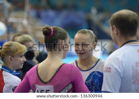 MOSCOW, RUSSIA - APRIL 20: Maria Paseka, Russia talks with her teammates after exercise on uneven bars in final of 5th European Championships in Artistic Gymnastics in Moscow, Russia on April 20, 2013
