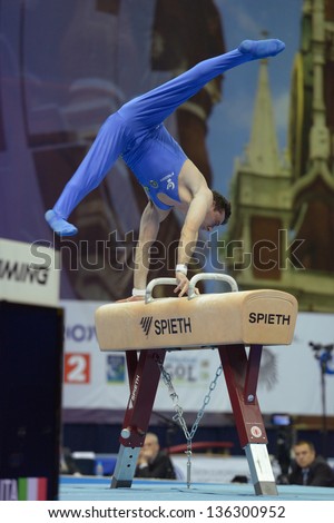 MOSCOW, RUSSIA - APRIL 20: Alberto Busnari, Italy performs exercise on pommel horse in final of 5th European Championships in Artistic Gymnastics in Moscow, Russia on April 20, 2013