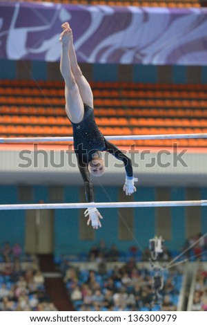 MOSCOW, RUSSIA - APRIL 20: Jonna Adlerteg, Sweden performs exercise on uneven bars in final of 5th European Championships in Artistic Gymnastics in Moscow, Russia on April 20, 2013