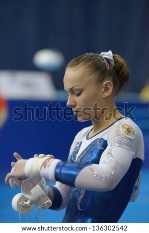 MOSCOW, RUSSIA - APRIL 20: Maria Paseka, Russia prepares for exercise on uneven bars in final of 5th European Championships in Artistic Gymnastics in Moscow, Russia on April 20, 2013