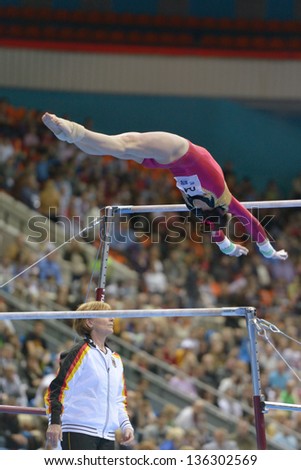MOSCOW, RUSSIA - APRIL 20: Sophie Scheder, Germany performs exercise on uneven bars in final of 5th European Championships in Artistic Gymnastics in Moscow, Russia on April 20, 2013