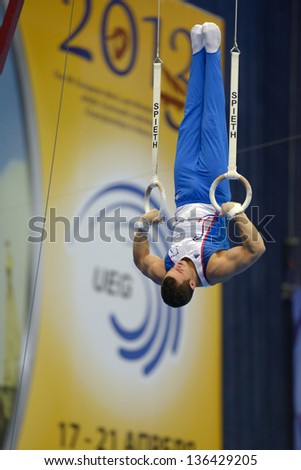MOSCOW, RUSSIA - APRIL 20: Samir Ait Said, France performs exercise on still rings in final of 5th European Championships in Artistic Gymnastics in Moscow, Russia on April 20, 2013