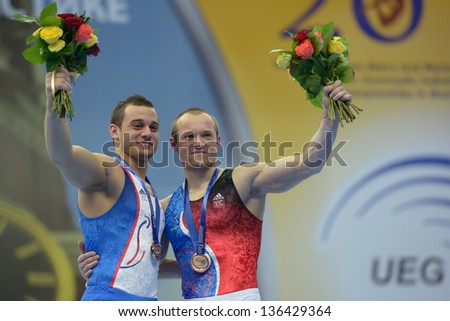 MOSCOW, RUSSIA - APRIL 20:  Ait Said, left, and Pinheiro-Rodrigues, both - France win medals on still rings of 5th European Championships in Artistic Gymnastics in Moscow, Russia on April 20, 2013