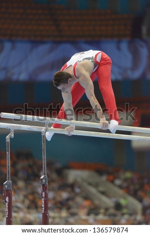 MOSCOW, RUSSIA - APRIL 21: Lucas Fischer, Switzerland performs exercise on parallel bars in final of 5th European Championships in Artistic Gymnastics in Moscow, Russia on April 21, 2013