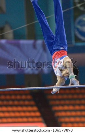 MOSCOW, RUSSIA - APRIL 21: Emin Garibov, Russia performs exercise on high bar in final of 5th European Championships in Artistic Gymnastics in Moscow, Russia on April 21, 2013