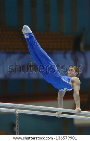 MOSCOW, RUSSIA - APRIL 21: Oleg Stepko, Ukraine performs exercise on parallel bars in final of 5th European Championships in Artistic Gymnastics in Moscow, Russia on April 21, 2013
