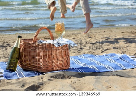 Glasses with champagne on a picnic basket Glasses with champagne on a picnic basket
