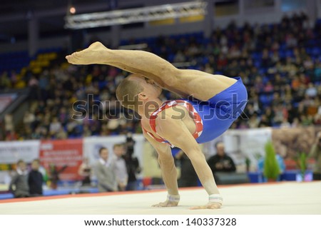 KIEV, UKRAINE - MARCH 31: Filip Ude, Croatia performs the floor exercise during International Tournament in Artistic Gymnastics Stella Zakharova Cup in Kiev, Ukraine on March 31, 2013