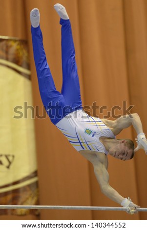 KIEV, UKRAINE - MARCH 31: Oleg Vernyaev, Ukraine performs exercise on high bar during International Tournament in Artistic Gymnastics Stella Zakharova Cup in Kiev, Ukraine on March 31, 2013