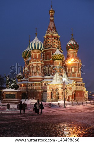 MOSCOW, RUSSIA - JANUARY 16: People walks near St. Basil\'s Cathedral on Red Square in Moscow, Russia on January 16, 2013. The Cathedral is listed as UNESCO World Heritage site
