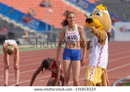 DONETSK, UKRAINE - JULY 14: World Youth Champion in 800 meters Hinriksdottir, Iceland accept congratulations from the mascot of 8th IAAF World Youth Championships in Donetsk, Ukraine on July 14, 2013