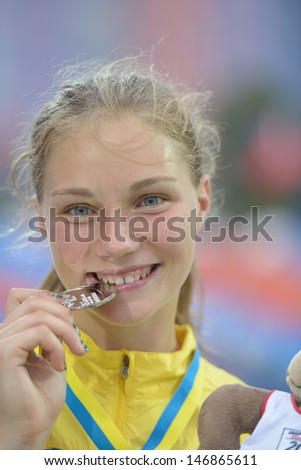 DONETSK, UKRAINE - JULY 13: Emma Stenlof of Sweden bite her silver medal in Heptathlon girls on medal ceremony during 8th IAAF World Youth Championships in Donetsk, Ukraine on July 13, 2013