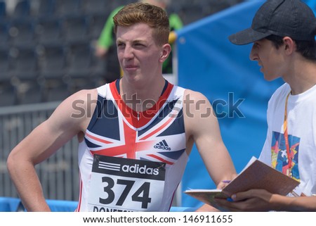DONETSK, UKRAINE - JULY 12: Thomas Somers of Great Britain talk with press after he win the heat in 200 metres during 8th IAAF World Youth Championships in Donetsk, Ukraine on July 12, 2013
