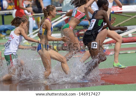 DONETSK, UKRAINE - JULY 12: Girls compete in 2000 m steeplechase during 8th IAAF World Youth Championships in Donetsk, Ukraine on July 12, 2013