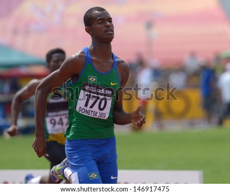 DONETSK, UKRAINE - JULY 12: Vitor Hugo dos Santos of Brazil (in front) and Sean Banda of Zimbabwe compete in 200 metres during 8th IAAF World Youth Championships in Donetsk, Ukraine on July 12, 2013