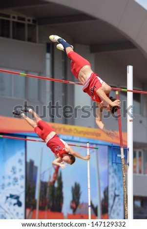DONETSK, UKRAINE - JULY 12: Devin King (in front) and Paulo Benavides of USA compete in Pole Vault during 8th IAAF World Youth Championships in Donetsk, Ukraine on July 12, 2013