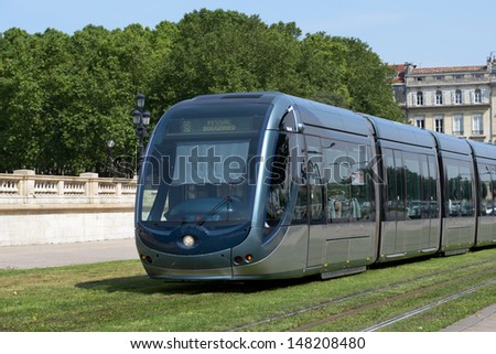 BORDEAUX, FRANCE - JUNE 27: Modern tram in the center of Bordeaux, France on June 27, 2013. The ground-level power supply was invented by APC company especially for the Bordeaux tramway system
