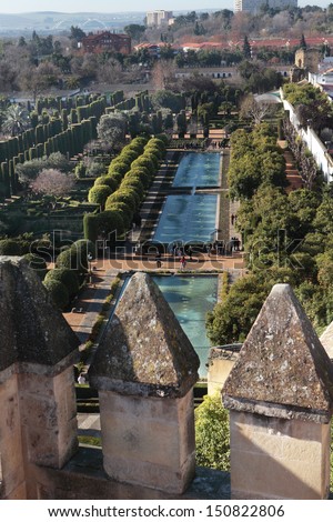 CORDOBA, SPAIN - JANUARY 4: View to the garden with pools from the tower of Alcazar in Cordoba, Spain on January 4, 2013. Since 1994, Alcazar included in UNESCO World Heritage list
