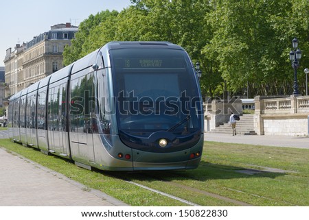 BORDEAUX, FRANCE - JUNE 27: Modern tram in the center of Bordeaux, France on June 27, 2013. The ground-level power supply was invented by APC company especially for the Bordeaux tramway system