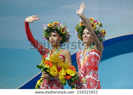 KIEV, UKRAINE - AUGUST 29: Margarita Mamun (left) and Yana Kudryavtseva of Russia win gold medals during the 32nd Rhythmic Gymnastics World Championships in Kiev, Ukraine on August 29, 2013