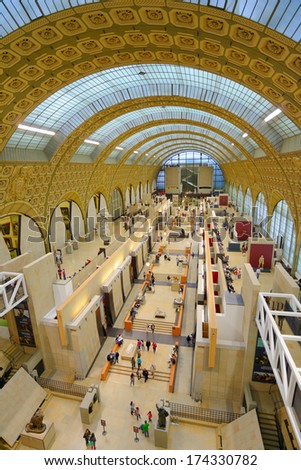 PARIS, FRANCE - SEPTEMBER 12, 2013: People in the Musee d\'Orsay. Opened in 1986, the museum houses the largest collection of impressionist and post-impressionist masterpieces in the world