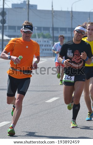 MOSCOW, RUSSIA - MAY 18, 2014: Runners on the distance of Moscow Half Marathon. It is the second race of the Moscow Marathon race series