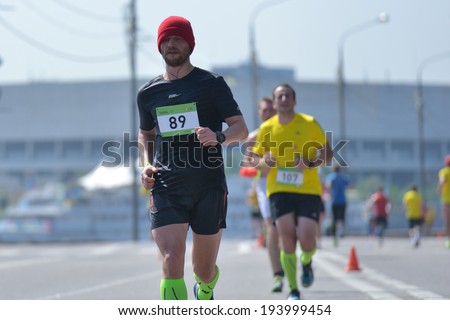 MOSCOW, RUSSIA - MAY 18, 2014: Runners on the distance of Moscow Half Marathon. It is the second race of the Moscow Marathon race series