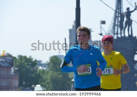 MOSCOW, RUSSIA - MAY 18, 2014: Young runners on the distance of Moscow Half Marathon. It is the second race of the Moscow Marathon race series