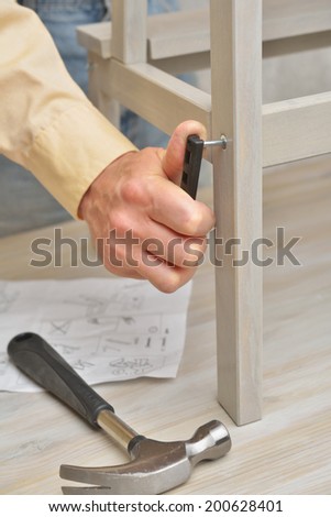 Man assembling the step stool