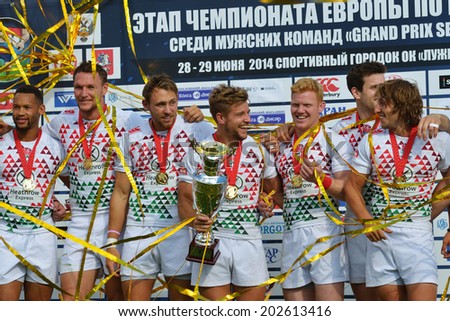 MOSCOW, RUSSIA - JUNE 29, 2014: Team England during award ceremony of the FIRA-AER European Grand Prix Series. The captain Tom Mitchell holds the Cup
