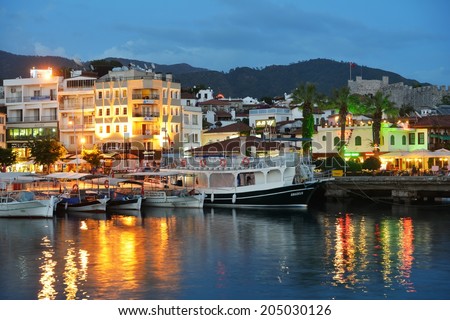 MARMARIS, TURKEY - MAY 15, 2014: Trip boats moored on the embankment in the night. Boat trips are lovely recreational activity for thousands of tourists