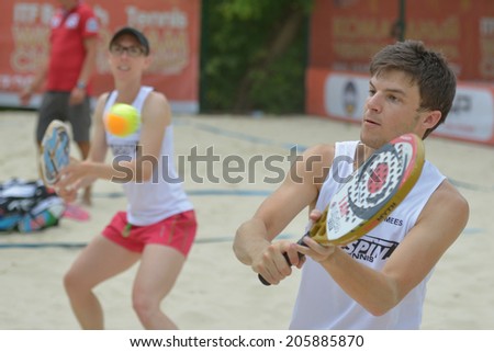 MOSCOW, RUSSIA - JULY 17, 2014: Mixed team Belgium in the match with Great Britain during ITF Beach Tennis World Team Championship. Belgium won the round 3-0