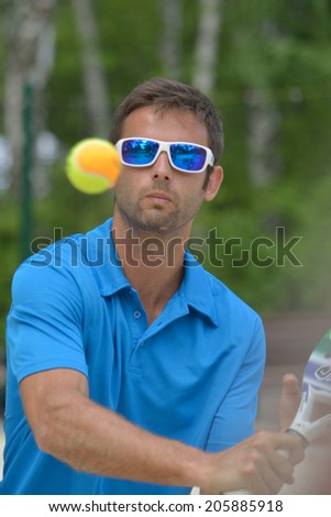MOSCOW, RUSSIA - JULY 17, 2014: Raphael Jannel of France in the match with Greece during ITF Beach Tennis World Team Championship. France won in two sets