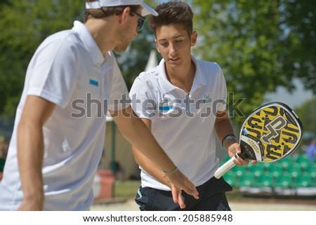 MOSCOW, RUSSIA - JULY 17, 2014: Men team San Marino in the match with Bulgaria during ITF Beach Tennis World Team Championship. San Marino won in two sets