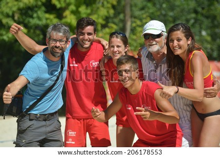 MOSCOW, RUSSIA - JULY 20, 2014: Team Spain celebrates the 5th place in ITF Beach Tennis World Team Championship. Spain beats Venezuela 2-0