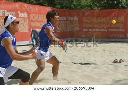 MOSCOW, RUSSIA - JULY 19, 2014: Man double of Japan in the match against Germany during ITF Beach Tennis World Team Championship. Japan won this rubber, but German won the match