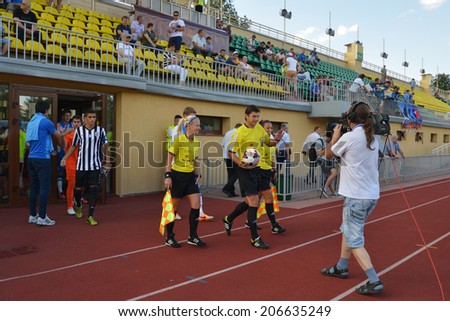MOSCOW, RUSSIA - JULY 21, 2014: Teams come out on the field before the match Dynamo, Moscow - PAOK, Greece during Lev Yashin VTB Cup, the international soccer tournament for U21 teams. Dynamo won 3-2