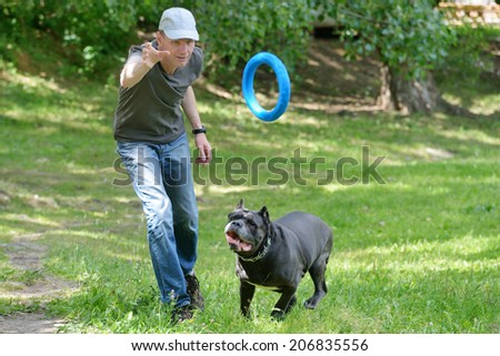 Man playing with his dog in the park