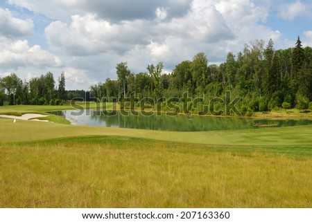 TSELEEVO, MOSCOW REGION, RUSSIA - JULY 24, 2014: Golf course in the Tseleevo Golf & Polo Club during the M2M Russian Open. The course was designed by Jack Nicklaus, the famous professional golfer