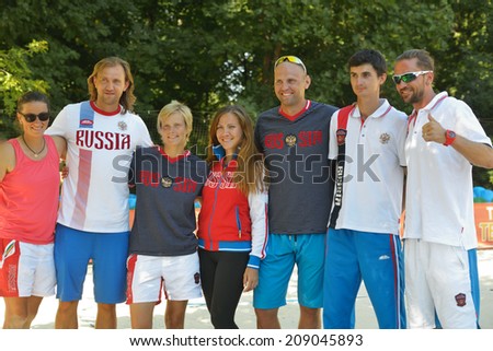 MOSCOW, RUSSIA - JULY 20, 2014: Team Russia celebrates the 3rd place in ITF Beach Tennis World Team Championship. In the match for the 3rd place Russia beat Germany 3-0