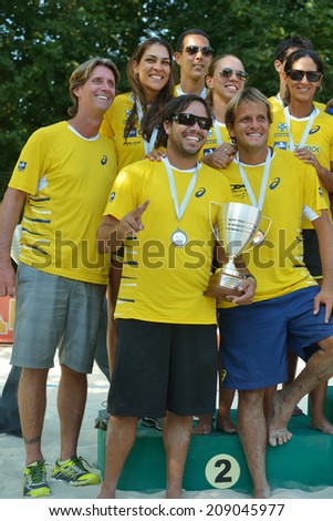 MOSCOW, RUSSIA - JULY 20, 2014: Team Brazil celebrates the 2nd place in ITF Beach Tennis World Team Championship. In the final match Brazil lost to Italy 0-2