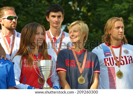 MOSCOW, RUSSIA - JULY 20, 2014: Team Russia celebrates the 3rd place in ITF Beach Tennis World Team Championship. In the match for the 3rd place Russia beat Germany 3-0