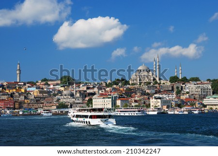 ISTANBUL, TURKEY - AUGUST 7, 2007: Ferry boats traverse the Golden Horn bay. The ferry is the fastest and cheapest way to traverse Bosporus strait
