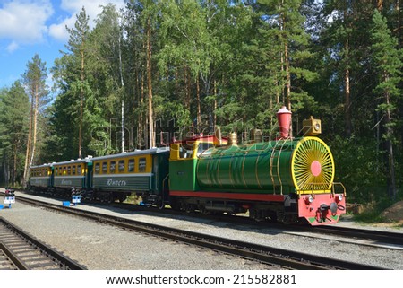 NOVOSIBIRSK, RUSSIA - AUGUST 20, 2014: Train on the station Sportivnaya of Children\'s railway. Built in 2005 for about $9 millions, it is one of the best children\'s railroad in Russia